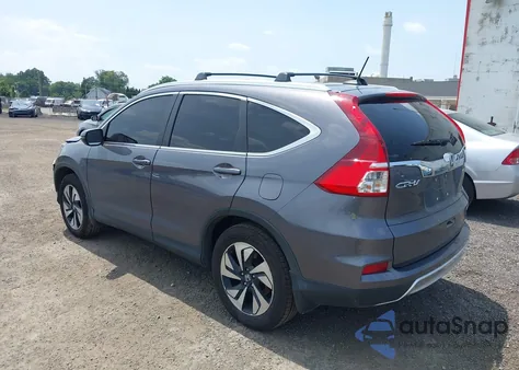 2015 Honda Cr-V Touring z USA, uszkodzony, nr VIN 5J6RM4H97FL125455